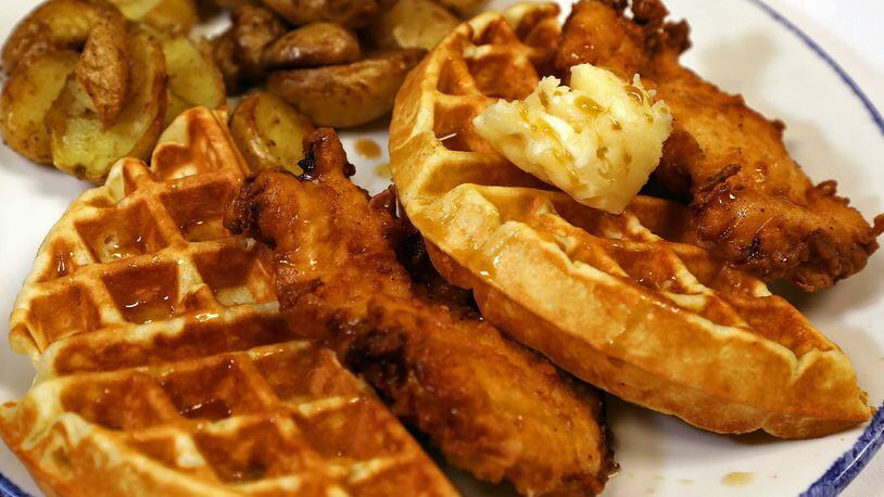 Chicken and Waffles are a popular item on the menu at Ellie’s Restaurant & Bakery. BILL LACKEY/STAFF