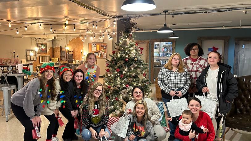 Pictured is a scene from the annual YoungLives Christmas Club party earlier this month. YoungLives provides support for teen moms and moms-to-be from 14 to 21. PROVIDED