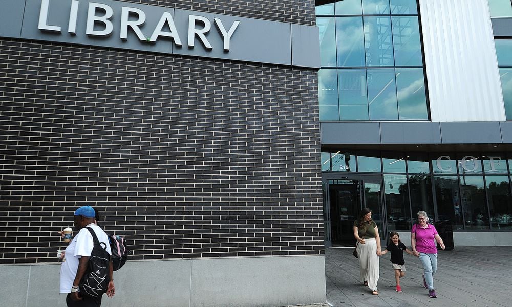 Lots of visitors coming and going Wednesday, May 22, 2024, at Dayton Metro Librarys main branch. MARSHALL GORBY\STAFF