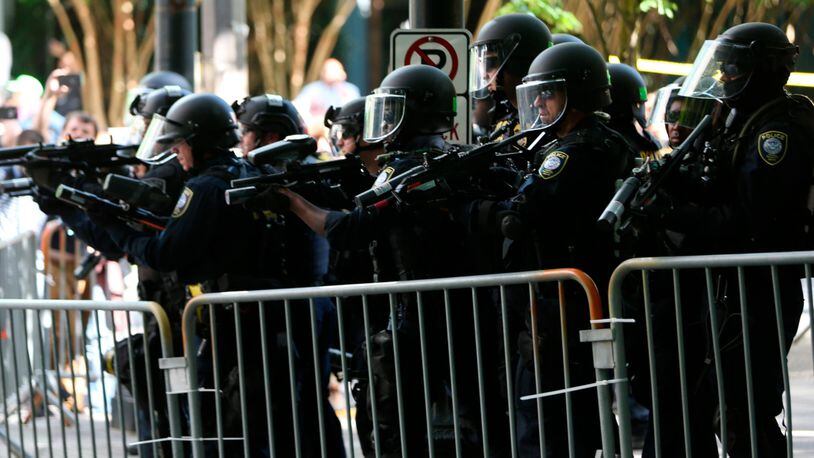 Opposing groups clash during Oregon rallies; police declare riot