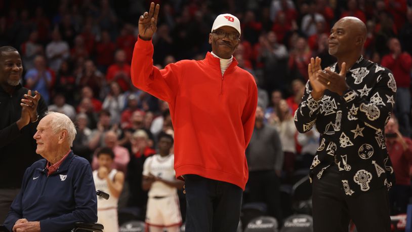 Roosevelt Chapman waves to the crowd during a ceremony honoring members of Dayton's 1984 Elite Eight team at halftime of a game against Grambling State on Saturday, Dec. 2, 2023, at UD Arena. David Jablonski/Staff