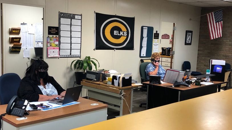 School office staff in Centerville High School's south unit answer calls and prepare for the start of the school year Wednesday, Aug. 5, 2020.