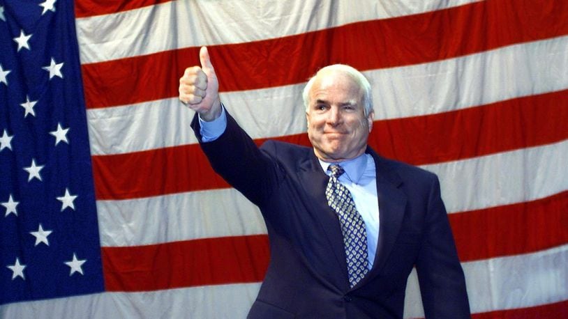 Former Republican presidential candidate U.S. Senator John McCain (R-AZ) waves to the crowd on Aug.11, 2000 at the University of Portland in Oregon. McCain was campaigning for Republican presidential nominee George W. Bush.