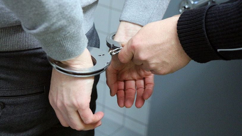 Stock photo of a man in handcuffs.