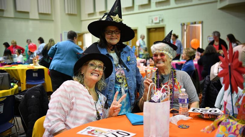 Some purse auction attendees come in costume. The annual event supports the Tipp Monroe Community Services summer lunch program. CONTRIBUTED PHOTOS