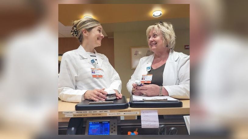 Patti McCormick, RN, PhD, left, is seen preparing Clinical Aromatherapy Care Plans for patients at Soin Medical with Elizabeth Madren, a graduate of IHL and a Certified Holistic Health practitioner.
