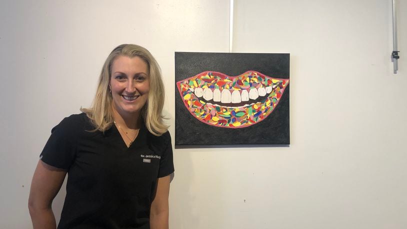 Jessica Kile is showing off a smile in the Champaign County Arts Council revival of one of its most popular fundraisers on May 7 with Bad Art by Good People, featuring a dinner and auction to bid on pieces created by local celebrities. Courtesy photo