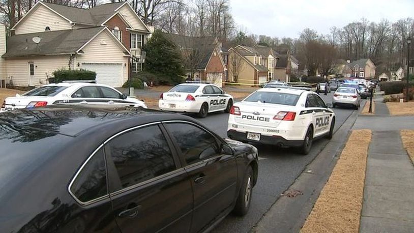 Police converge on a neighborhood in Lawrenceville, Georgia, where two teenagers were killed after playing with a gun.