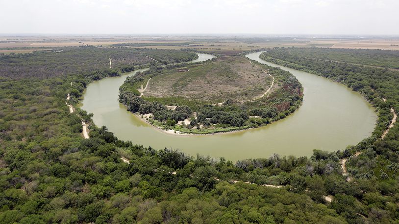 In this July 24, 2014, file photo, a bend in the Rio Grand is viewed from a Texas Department of Public Safety helicopter on patrol over in Mission, Texas. The U.S. government says a teenage Guatemalan died Monday, May 20, 2019, at a Border Patrol station in South Texas, the fifth death of a migrant child since December. (AP Photo/Eric Gay, Pool, File)