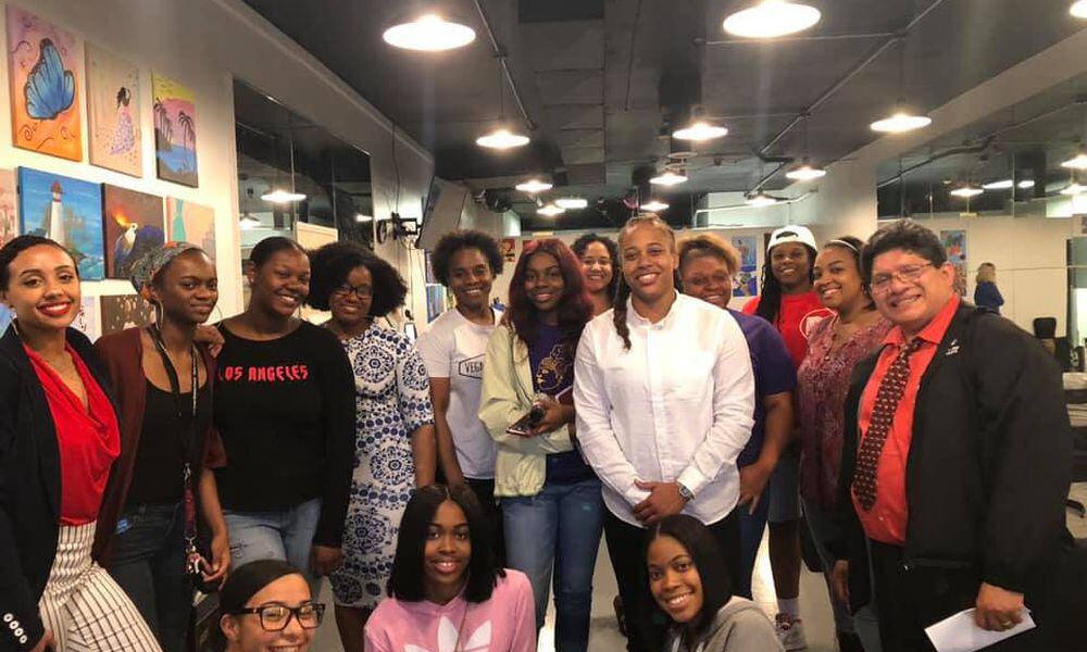 Daj’za Demmings (white shirt) is the president of Dayton Young Black Professionals, one of the organizations hosting a charity event in honor of the late former Dayton City Commissioner Idotha 