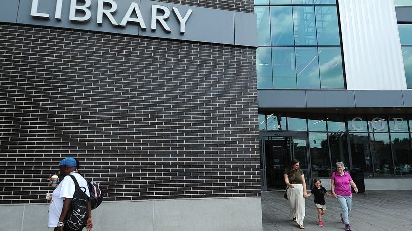Lots of visitors coming and going Wednesday, May 22, 2024, at Dayton Metro Library’s main branch. MARSHALL GORBY\STAFF