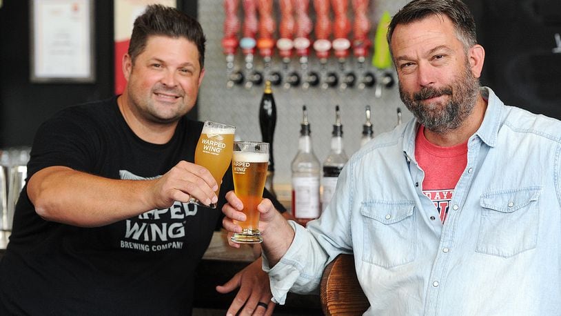Warped Wing Brewing Company owners, Nick Bowman, left, and John Haggerty at the 26 Wyandot St. location in Dayton.
MARSHALL GORBY\STAFF